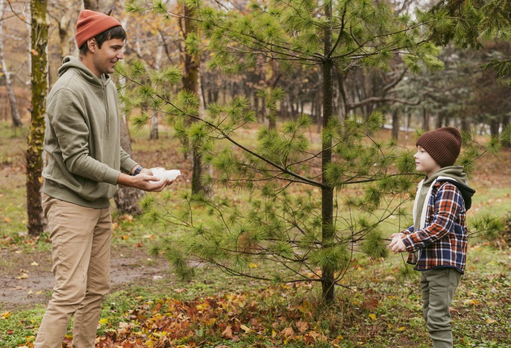 son-father-playing-outdoors-nature-together